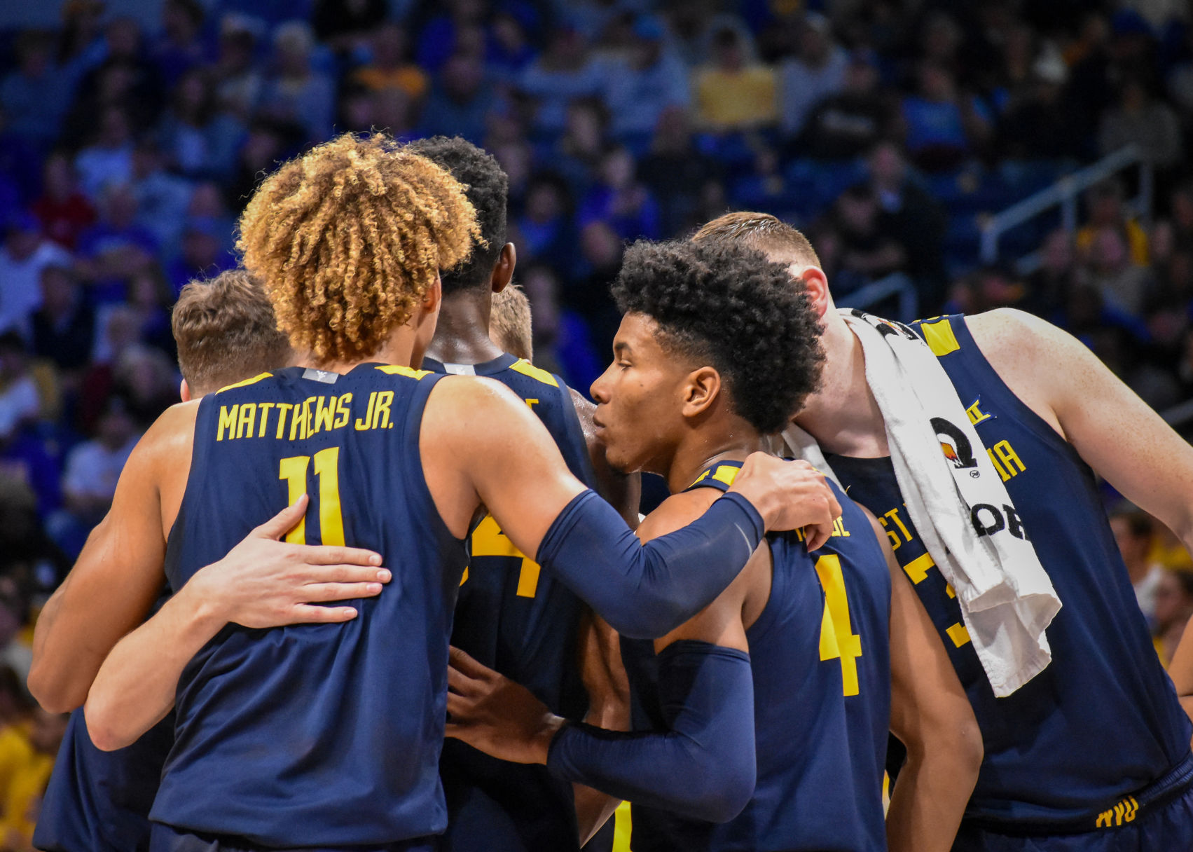 West Virginia forward Emmitt Matthews Jr. leads a team huddle when facing off against Pitt at the Petersen Events Center on Nov. 15, 2019.